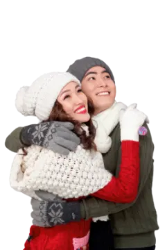a man and woman hugging in the snow