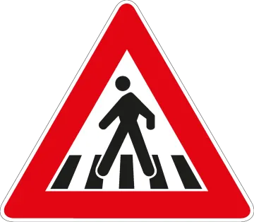 a road sign with a man walking across it
