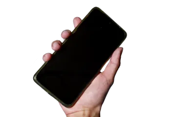 a person holding a cell phone in their hand