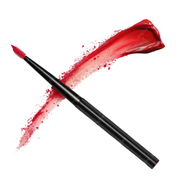 a mascara brush with red paint on it