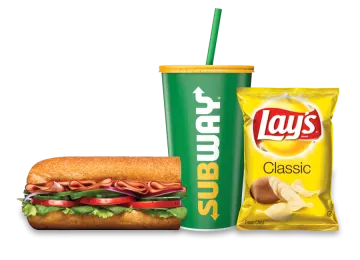 a sandwich with a drink and a bag of chips