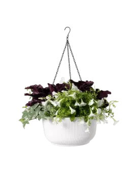a white hanging planter with green and purple flowers