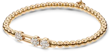 a gold bea bracelet with diamonds