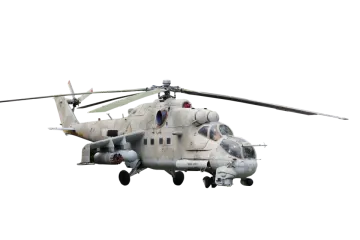 a military helicopter flying in the sky