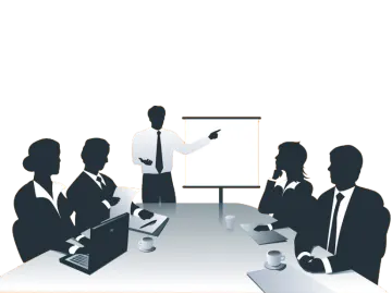 a group of people sitting around a conference table