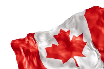the canadian flag is waving in the wind