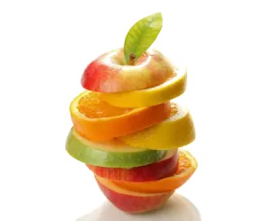 a stack of sliced fruit on a white surface