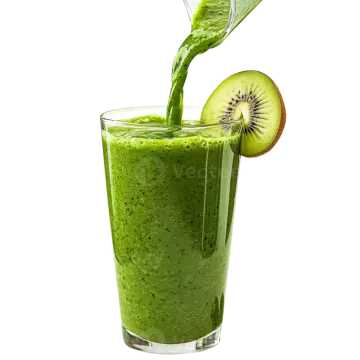 a glass filled with green smoothie next to a kil