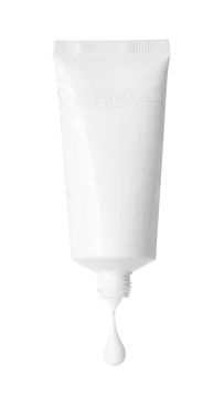 a tube of white paint on a white background