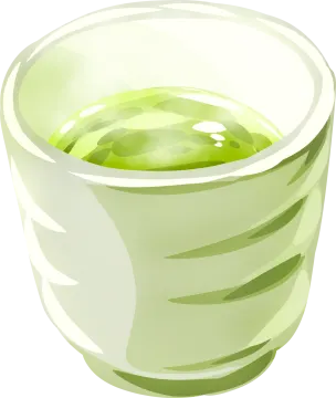 a glass filled with green liquid