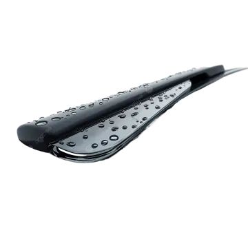 a close up of a black shower brush with water droplets