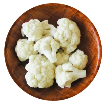 a wooden bowl filled with caulides