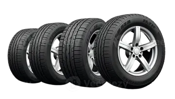 a set of four tires on white background