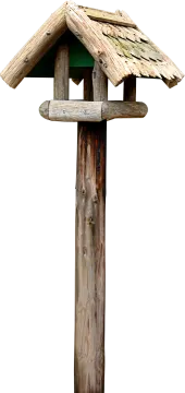 a bird house on top of a wooden pole