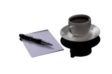 a cup of coffee and a pen on a paper