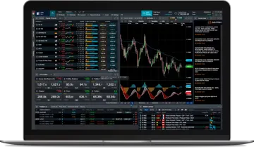 a laptop with trading on the screen