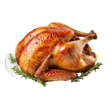 a roasted turkey on a plate with lemons and rosemary