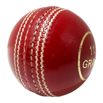 a red leather cricket ball on a white background