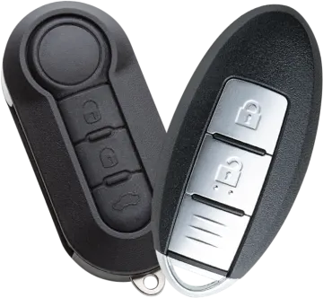 a pair of car keys on a white background