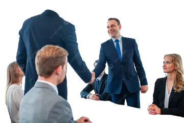 a group of people sitting around a conference table