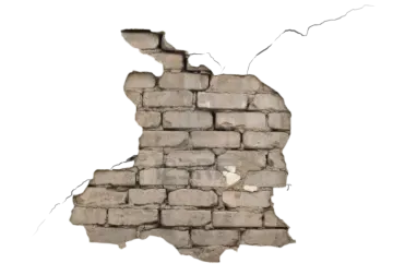 a brick wall with a hole in it