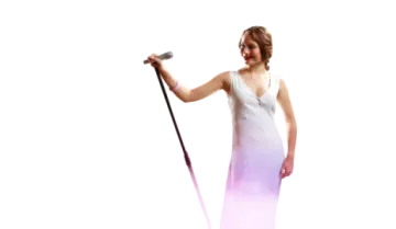 a woman in a white dress holding a microphone