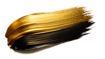 a brush with gold paint on it