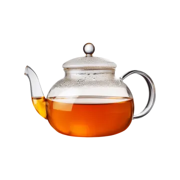 a glass tea pot filled with green tea