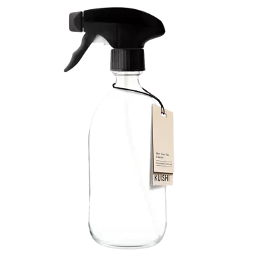 a black spray bottle with a white label on it