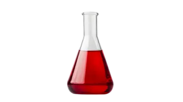 a red liquid in a glass bottle