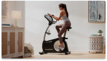 a woman on a stationary bike