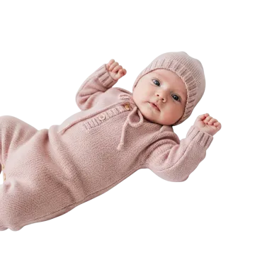 a baby doll wearing a pink sweater and hat