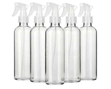 a set of four clear bottles with sprays