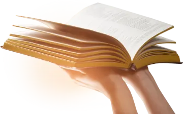 a person holding a book in their hand