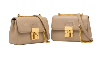 a pair of beige leather bags with gold hardwares