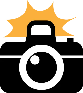 a camera with the sun in the background