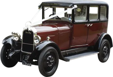 an old red car with a black roof