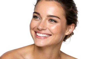 a woman smiling and holding a toothbrush