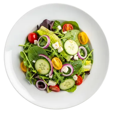 a white bowl filled with salad and vegetables