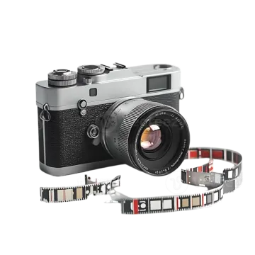 an old camera with a film strip around it