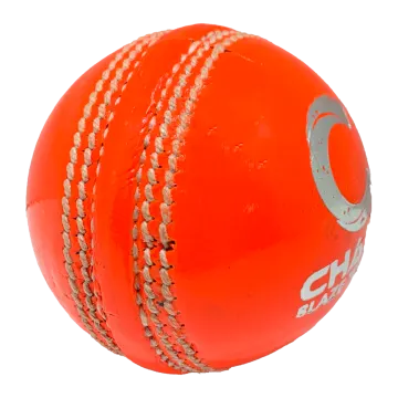 a red cricket ball on a white background