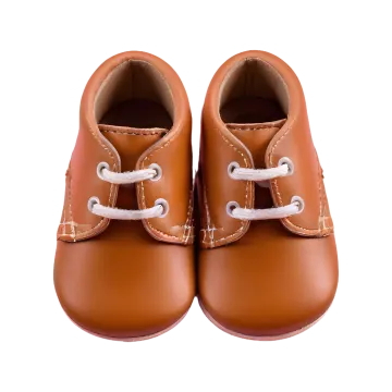 a pair of baby shoes on a white background