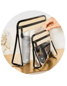 a hand holding a clear bag filled with various items