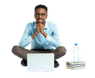 a man sitting on the floor with his laptop