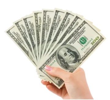 a person holding money in their hand
