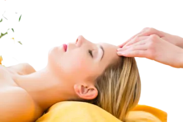 a woman getting a facial massage on her face