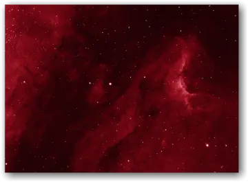 a large red nebula with stars in the background