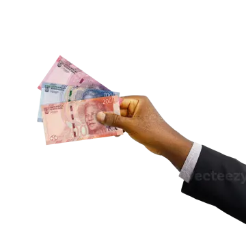 a hand holding several different bank notes