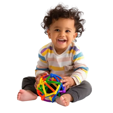 a baby sitting on the floor playing with a toy