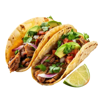 two pork tacoas with a lime wedge